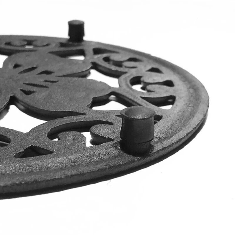

Cast Iron Teapot Trivet with Rubber Pegs for Dining and Kitchen Table, 7 Inch Diameter