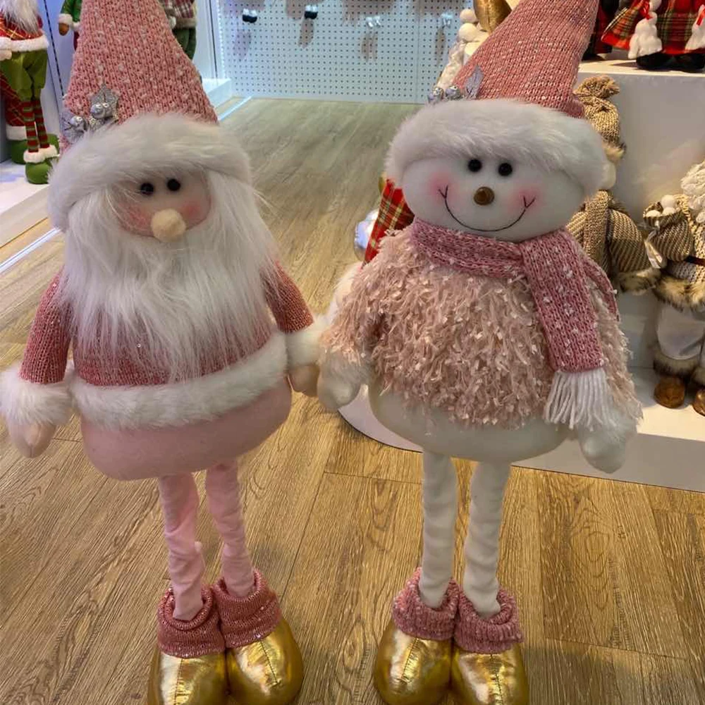 Розовые эластичные стоячие куклы Санта-Клауса и Снеговика из плюша как новогодние украшения для дома и подарки на Новый год 2023.