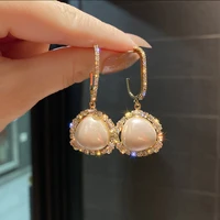 fashion shiny peach heart pearl earrings european and american personality light luxury high end earrings elegant ladies jewelry