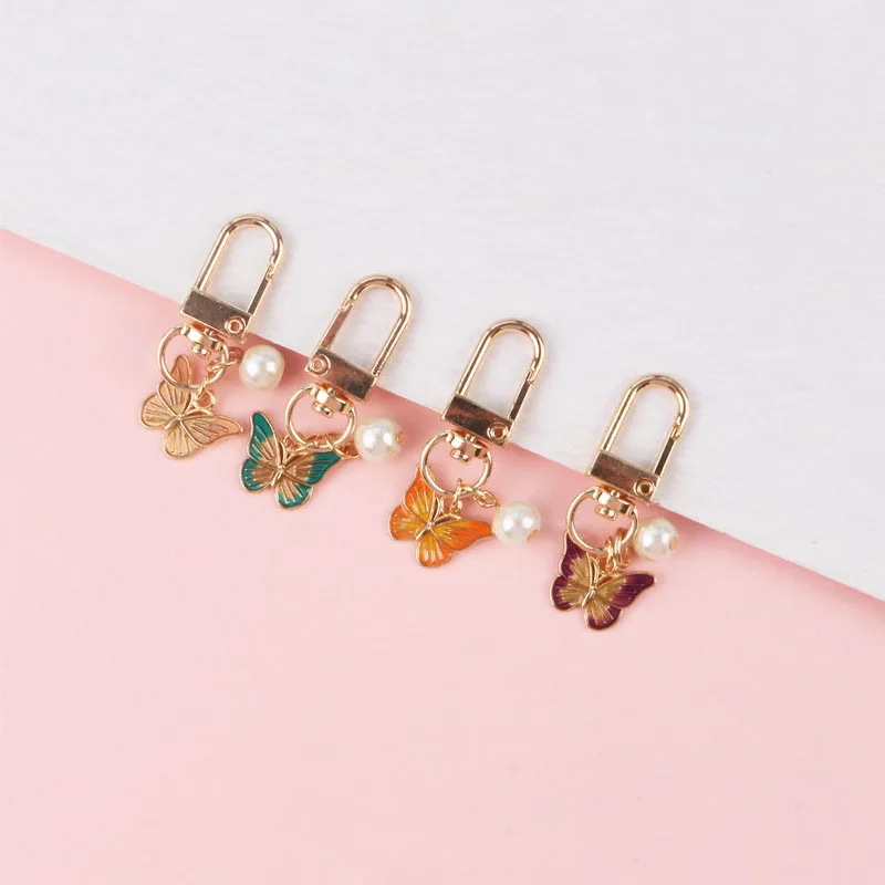 

Fashion Alloy Butterfly Pearl Keychain Animal Jewelry Gift Women Girl Car Bag Earphone Case Pendant Key Chain Exquisite Trinket
