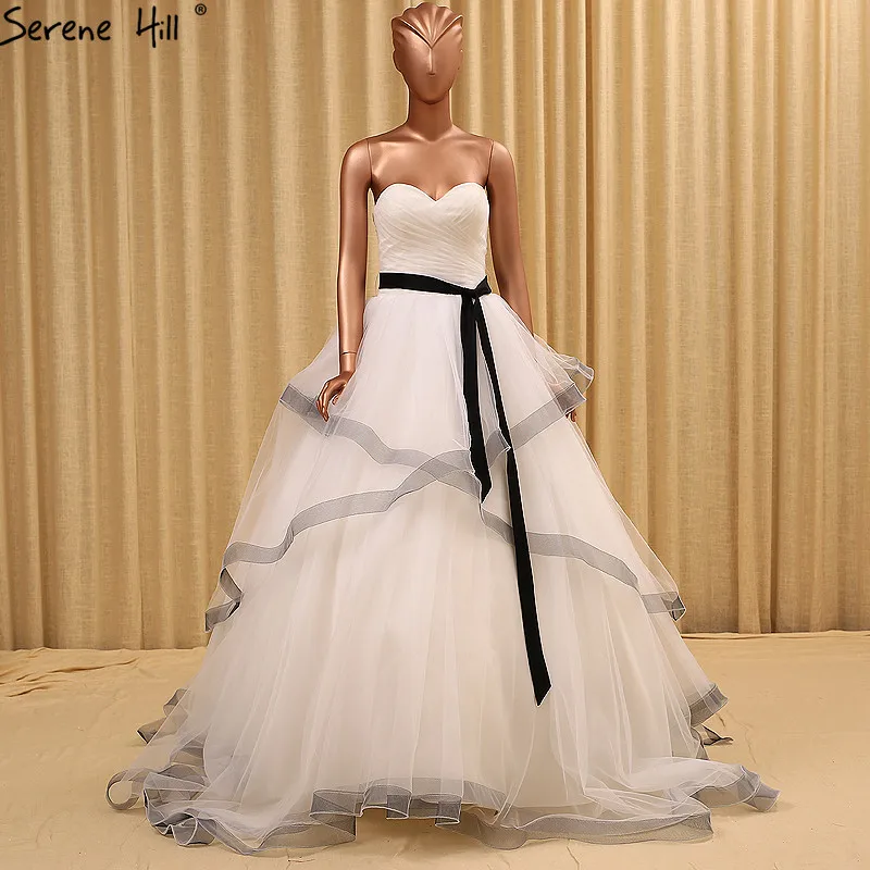 Настоящая фотография пышное свадебное платье из тюля с оборками бальное 2021