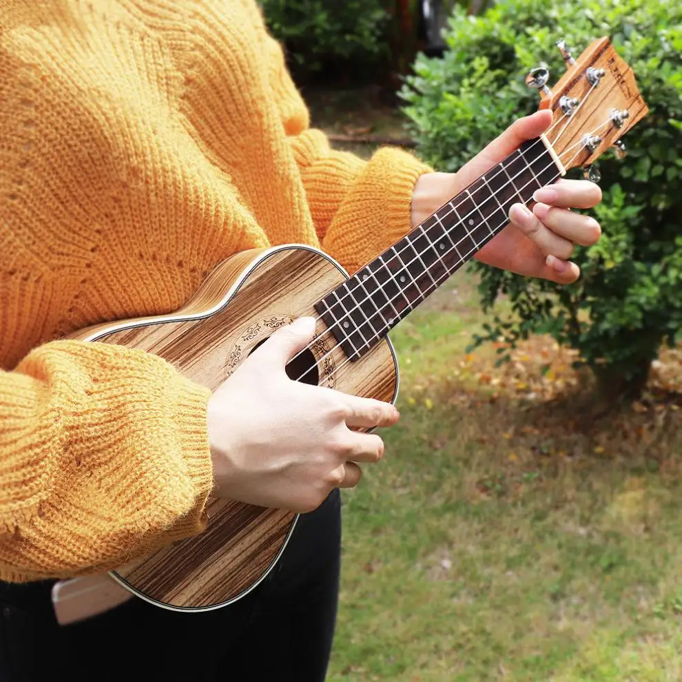 

21 Inch Soprano Ukulele Zebra Wood 15 Fret Four Strings Guitar + Bag + Tuner + String + Strap + Cloth
