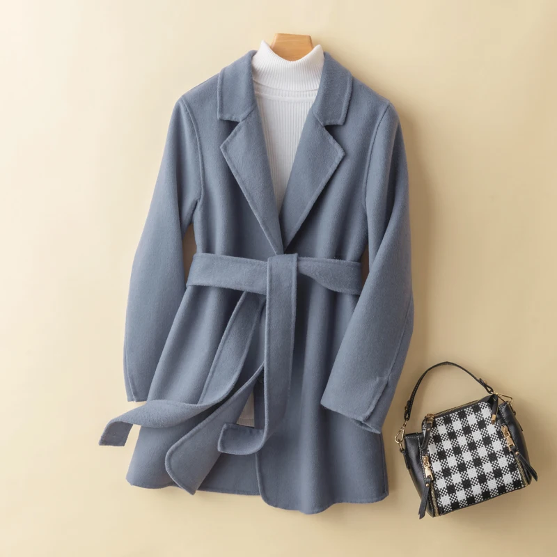 

Зимнее новое стильное женское пальто средней длины из 100% чистой шерсти, кашемировое пальто с лацканами и поясом, двухсторонний шерстяной то...