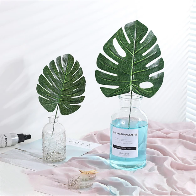 

62Pcs Artificial Palm Leaves Tropical Monstera Plant Faux Stems Jungle Party Decorations DIY Garden Home Decor for Wedding Party