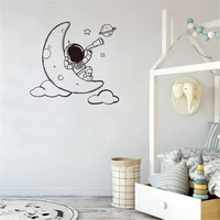 cute cartoon astronaut wall decal astronaut lying on the moon wall sticker home decor for kids room vinyl dw11332