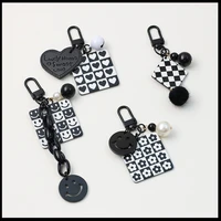 arrangement regular pattern keychain high cold black white street single product bag pendant airpods earphone shell accessory