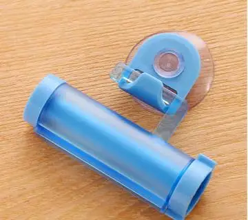 

Plastic rolling tube extruder toothpaste distributor suction cup holder toothpaste bathroom manual injection gun distributor