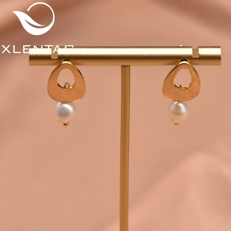 

Xlentag Natural Pearl Geometric Hollow Pendant Earrings Women's Wedding Engagement Fashion Simple Gift Jewelry GE1046D