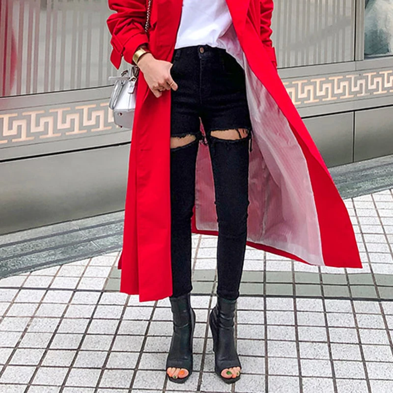 Женские эластичные джинсы черные рваные с бахромой на подоле уличные узкие