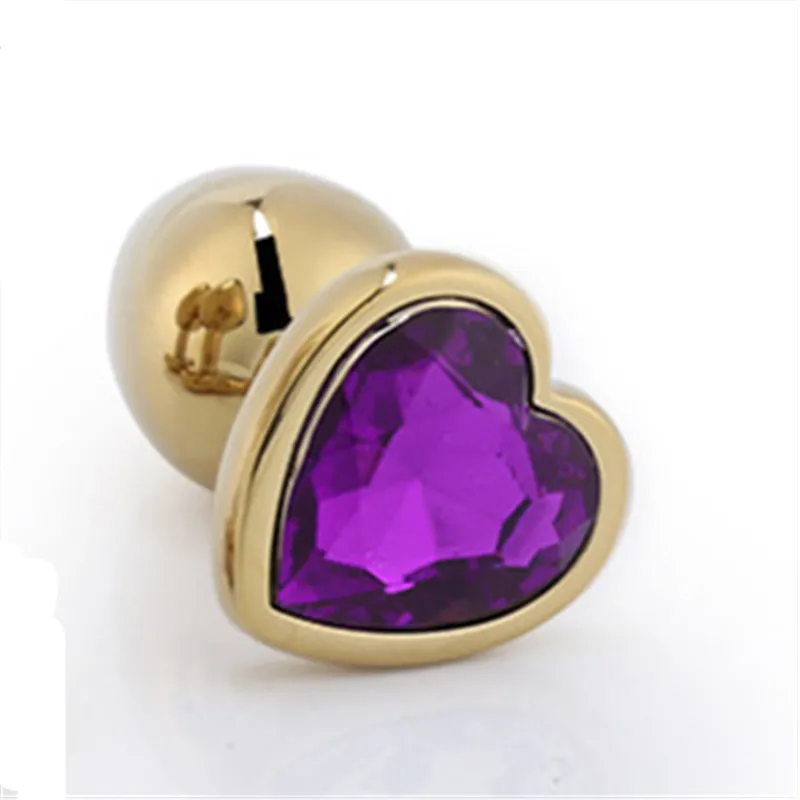 Анальная пробка золотого цвета в форме сердца металлическая с драгоценным