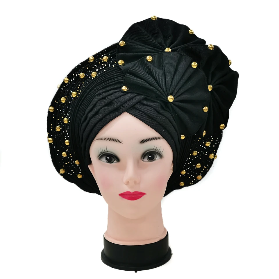 

Африканская Aso Oke уже сделала автомобильные колпачки головного убора