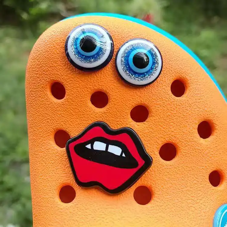 

Croc Charms Cool Funny Bundle Shoe Flower Decoration Designer Lovely Eyes Mouth Duckling Doll Croc Charms Finished Products