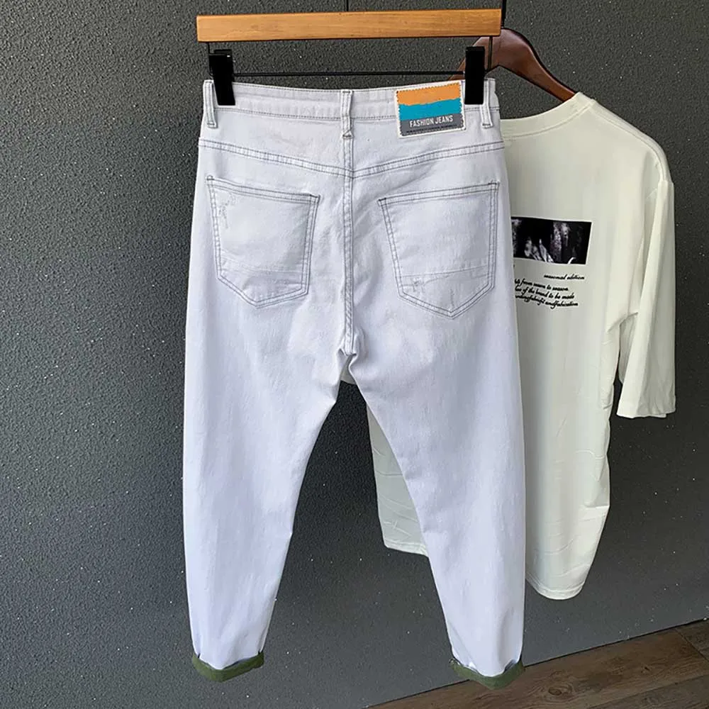 Модные белые рваные джинсы Мужские обтягивающие джинсовые штаны облегающие