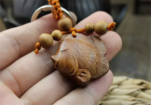 

Collectable Chinese Wood Carved Animal Fish Exquisite Small Pendant Statues