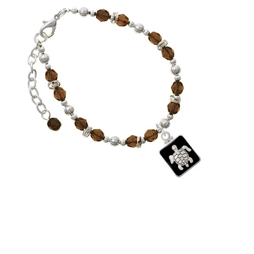 Коричневый браслет из бусин в черной оправе с черепахой |