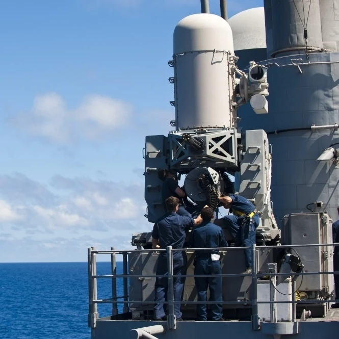 Sailors conduct maintenance on a Close-in Weapon System aboard USS Cowpens Poster Print (17 x 11) | Plaques &amp Signs
