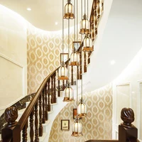 European style villa copper led staircase chandelier.Rotating high-rise decorative lighting.The pendant lamp on the top floor