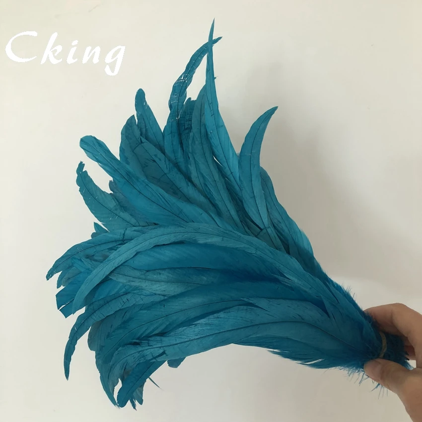 

Wholesale 100pc Turquoise Blue Rooster Coque Tail Feathers For Crafts wedding Decoration Costume Pheasant plumes 25 colors stock