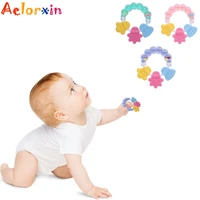 1pcs baby teethers rattle rings silicone massager infant training tooth toddler beads bell toys newborn nursing baby teethers
