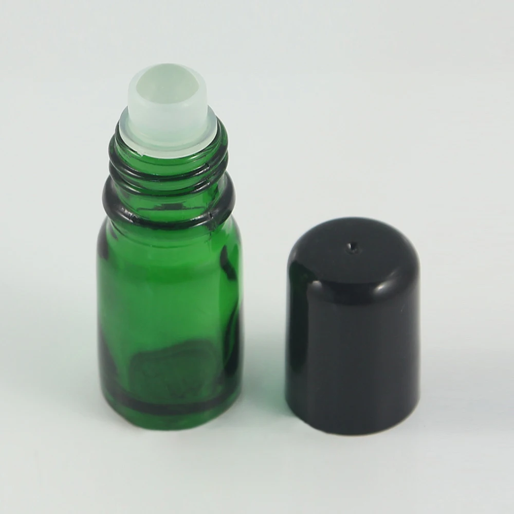 Empty glass green bottle with Glass/Metal Ball 5ml roller bottles with black lids for oils