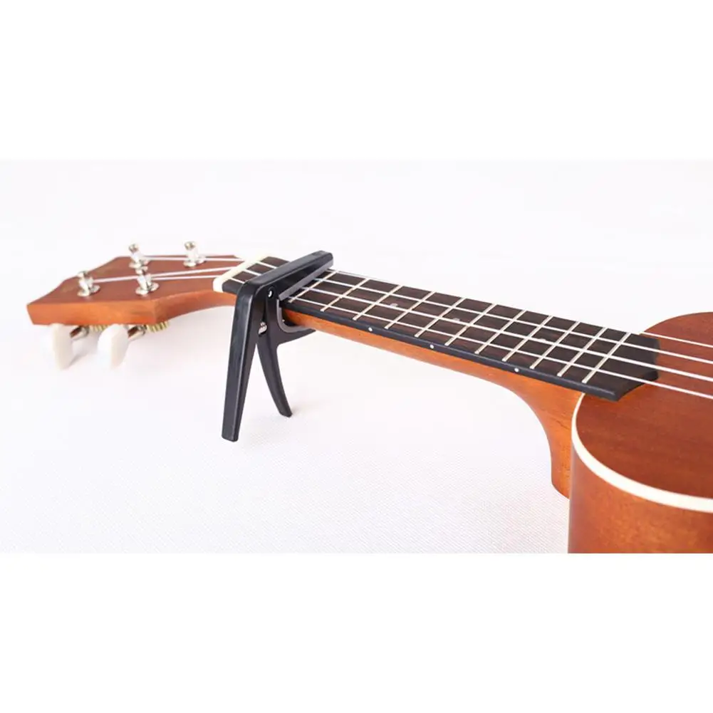 Capos Одноручный быстросменный каподастр Ukelele Capo 4 струны Запчасти и аксессуары для