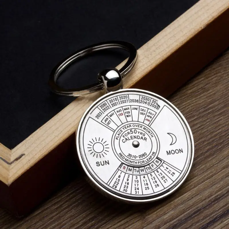 

Mini Perpetual Calendar 2021 Keychain Unique Metal Keyring Sun Moon Carving 2010 to 2060 Clock Calendar Key Ring Creative Gifts