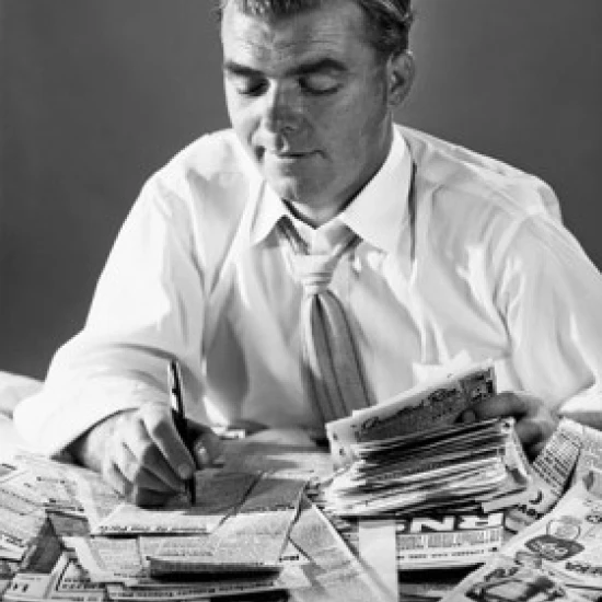 Close-up of a businessman writing on newspaper cuttings Poster Print (18 x 24) | Дом и сад