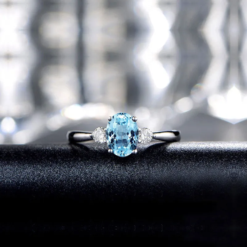 

QYI Trendy Blue Topaz Three Stone Ring 925 Sterling Silver Women Wedding Party Jewelry Oval Cut Gemstone Engagement Rings