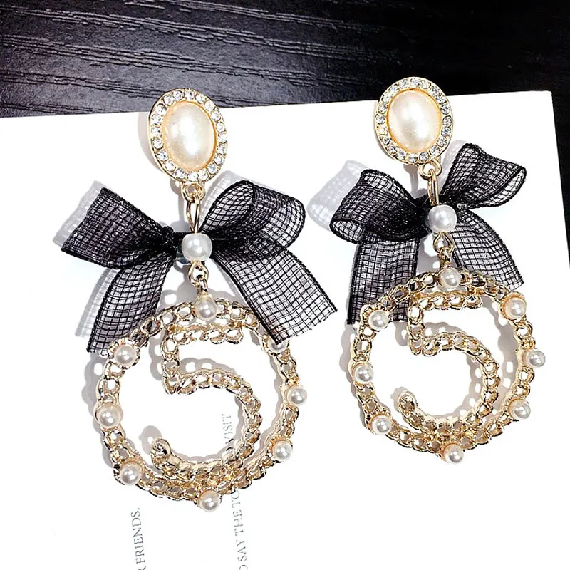 Асимметричные креативные серьги в горошек с бантом 5 длинными кисточками модные