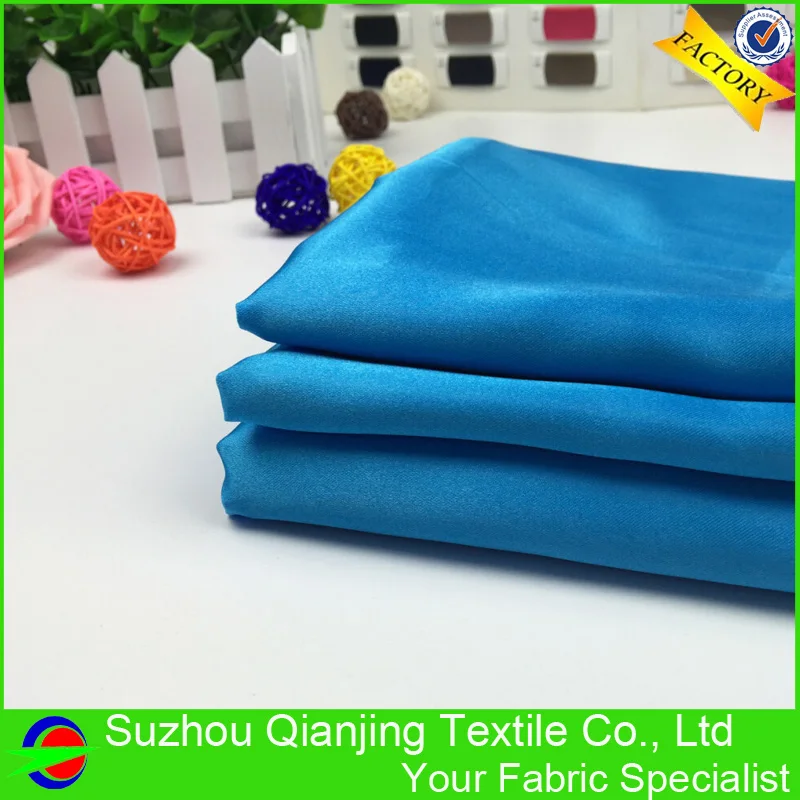 Блестящая гладкая мягкая кислота синяя полиэфирная атласная ткань высокого