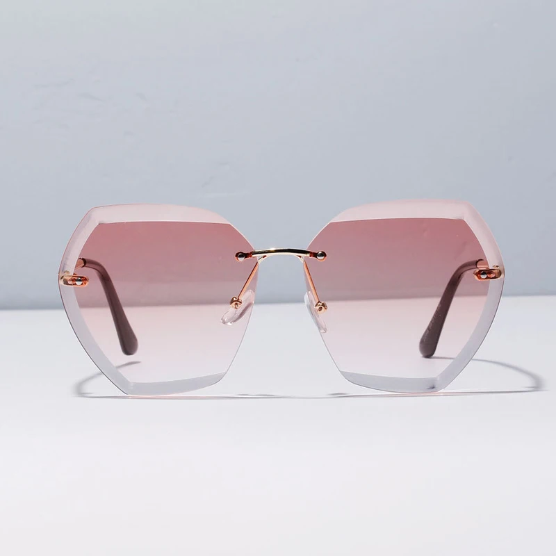 Популярные высококачественные женские солнцезащитные очки без оправы в стиле