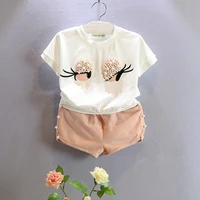2016 new summer kids sets girls clothes set fashion pearl big eye lashes short sleeve top shors suit girls clothing ses 2 7y