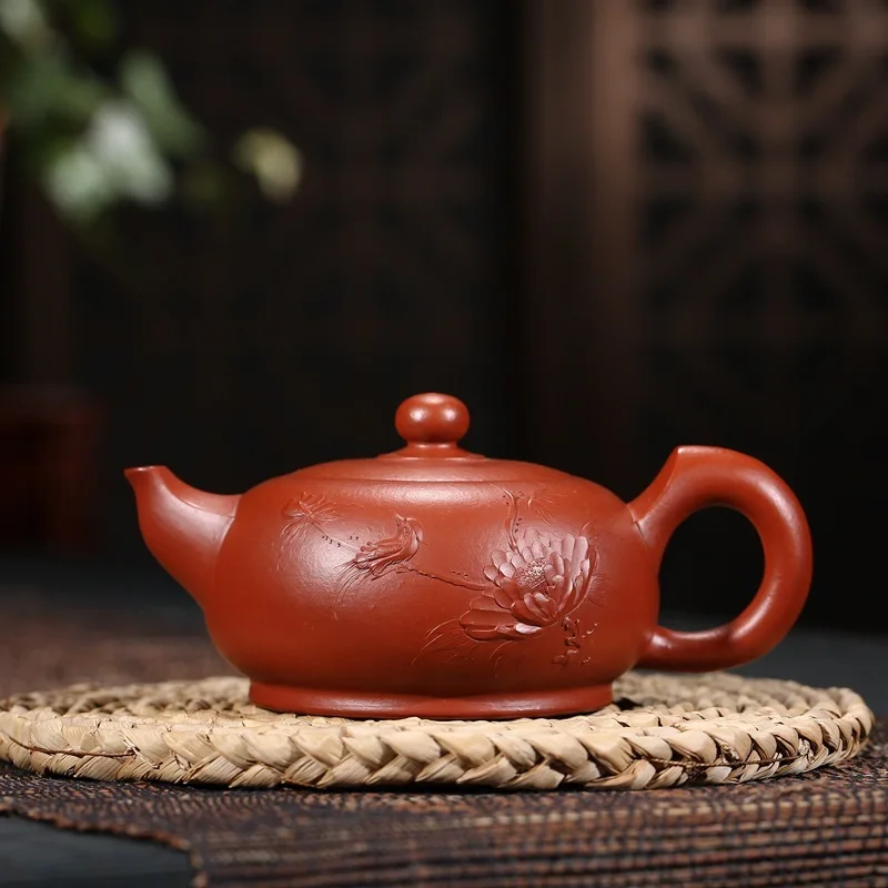 

Yixing famous authentic undressed ore recommended lotus rhyme pot gift teapot tea agent undertakes to new product