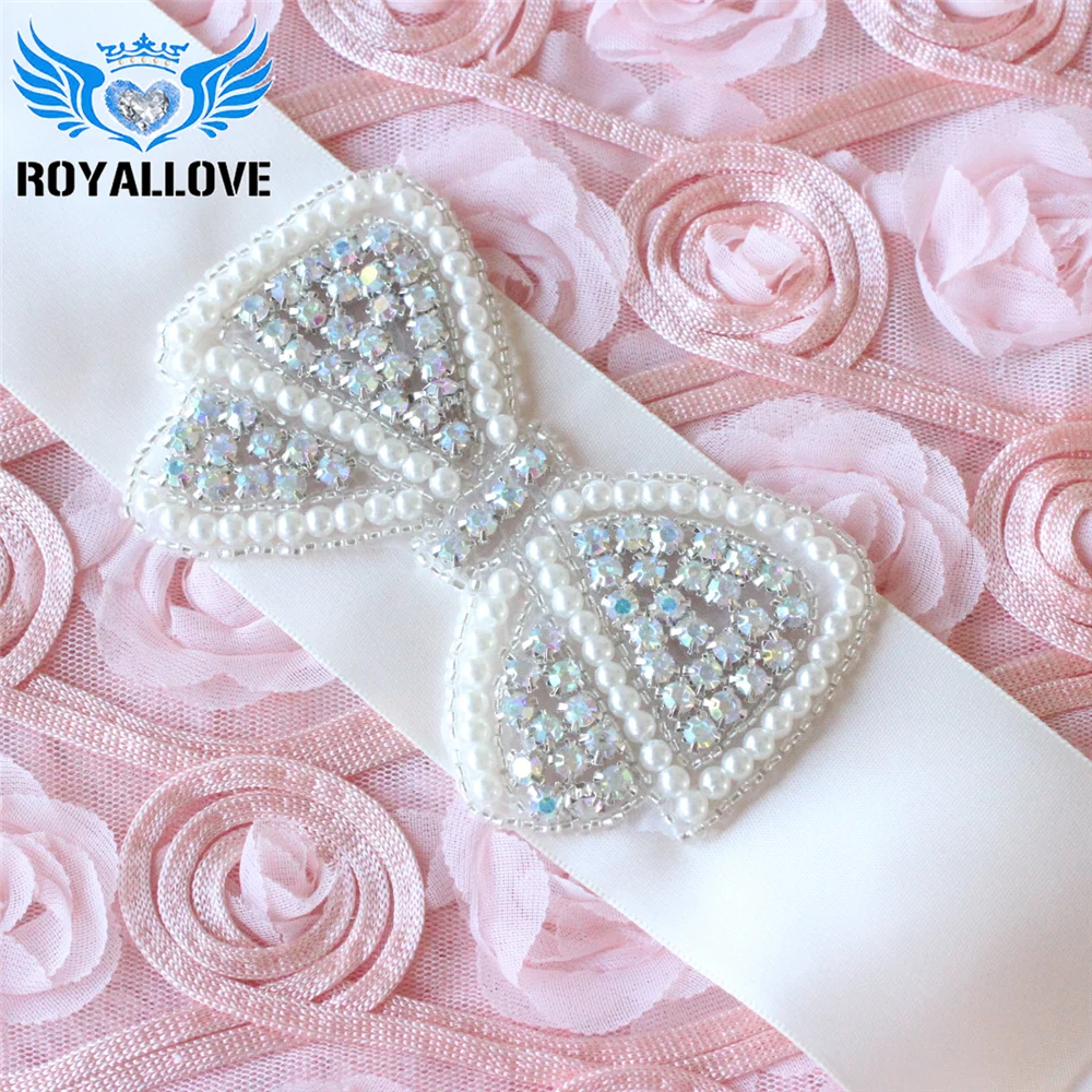 Оптовая продажа 30 штук аппликации из хрустальной бантиков с милым узором с жемчугом слоновой кости и бусинами из AB стразов для платьев и волос на ободках.