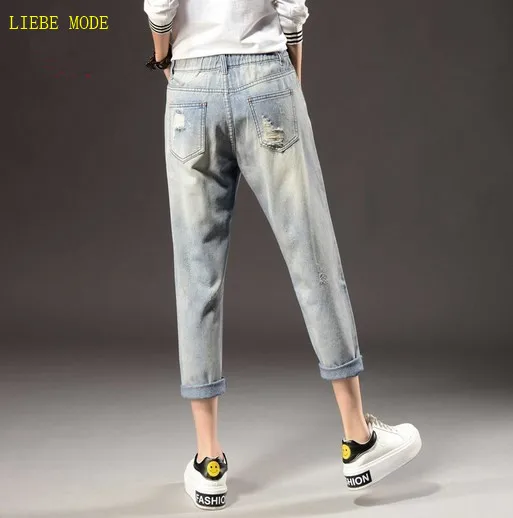 Джинсы женские рваные в потертом стиле модные штаны-султанки из денима до