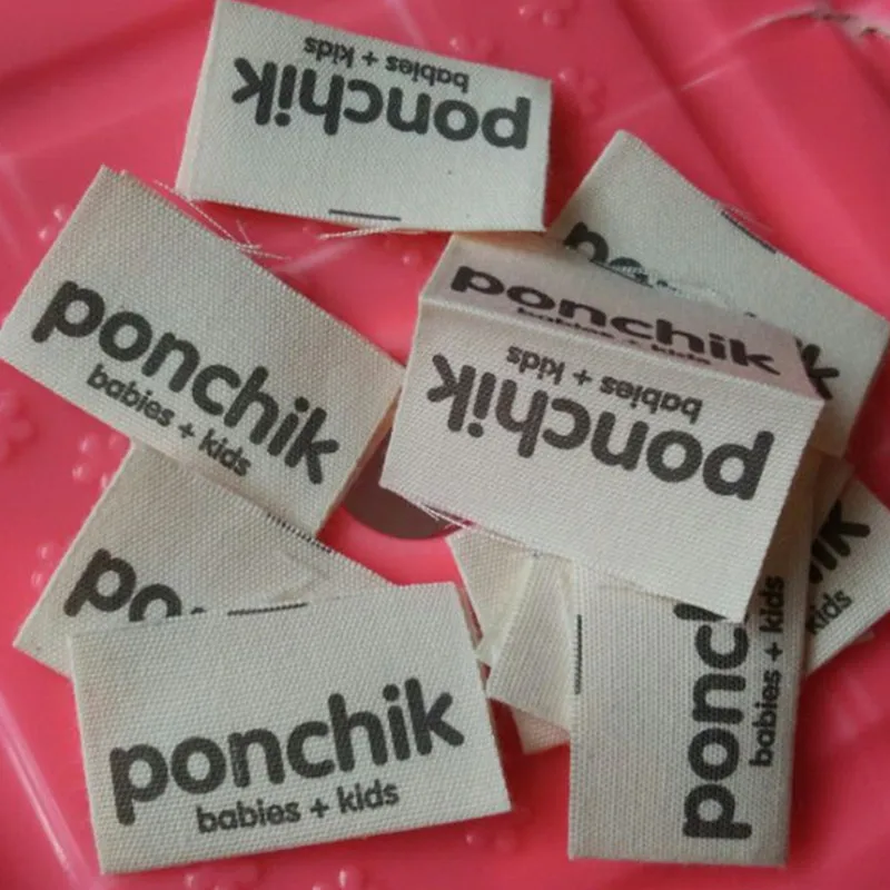 Изготовленные на заказ мягкие хлопковые этикетки с бежевым принтом тканые