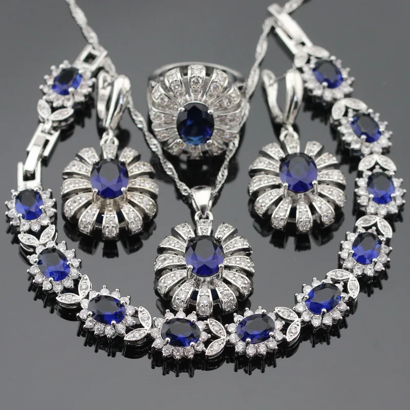 Женский серебряный ювелирный набор в форме цветка темно синий кристалл белый