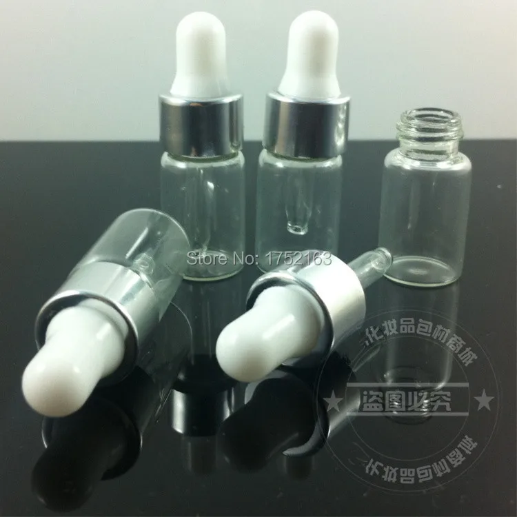 Прозрачная бутылка для эфирного масла объемом 3 мл и серебряное кольцо с белой