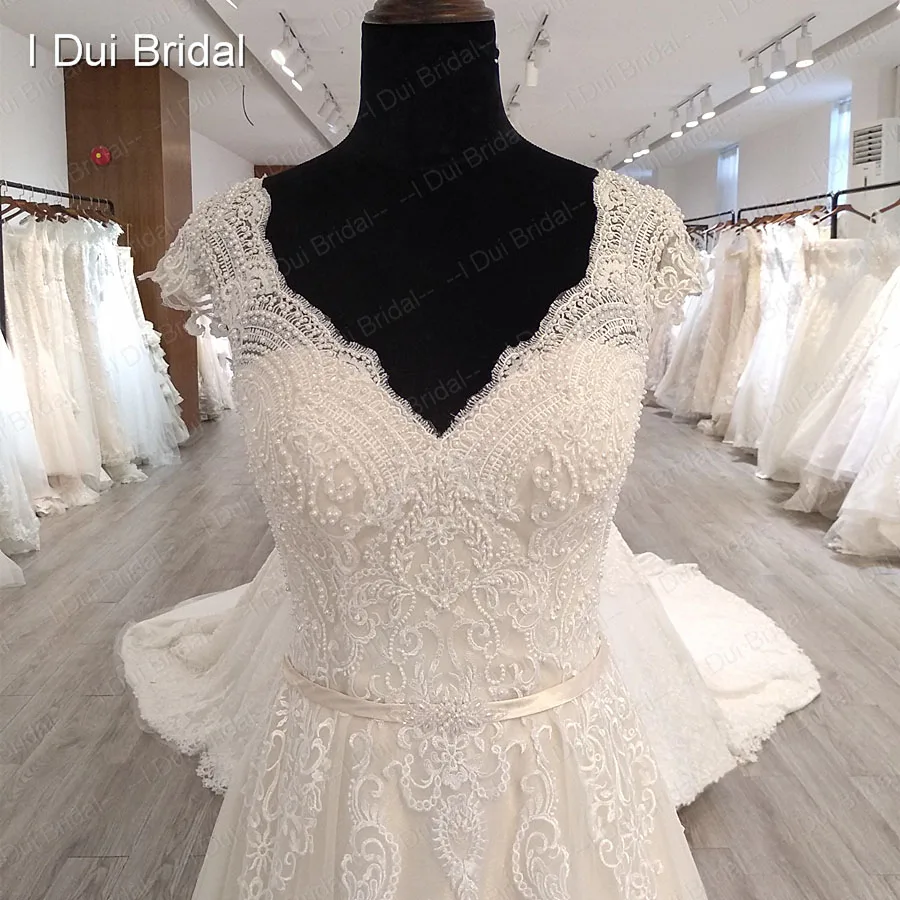 Cap Sleeve V Neckline Wedding Dress with Luxury Pearl Beaded Delicate Lace Bridal Gown High Quality Factory Custom Made