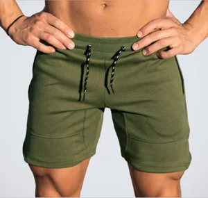 Мужские спортивные шорты ZOGAA, камуфляжный чистый цвет, мужской тренажерный зал, бодибилдинг, фитнес, спортивные шорты, повседневные облегающие военные мужские шорты