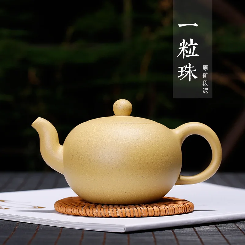 

Yixing Purple Sand Pot sells original mining mud, one pearl teapot wholesale authentic, hand-made engraved yellow mud