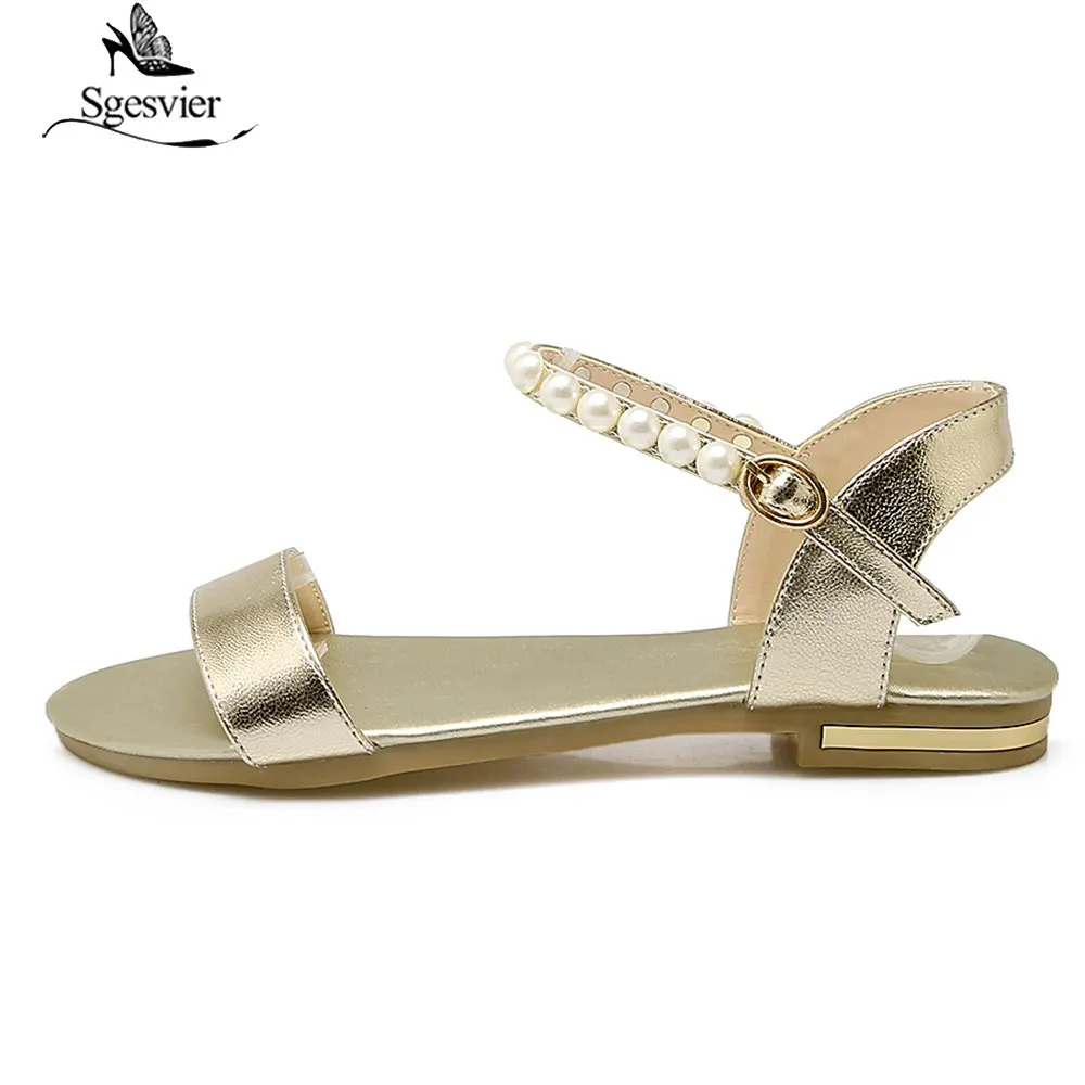 Женские сандалии из натуральной кожи на плоской подошве с ремешком и пряжкой |