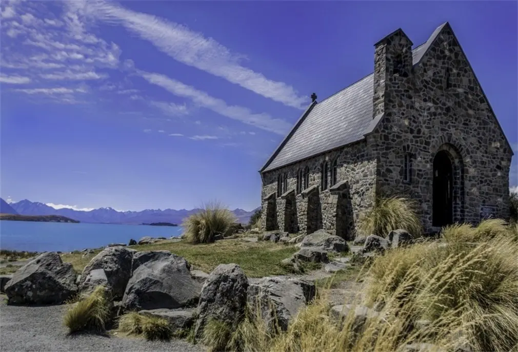 Фон для фотосъемки Приморский старинный кирпичный дом трава поле выветриваемые