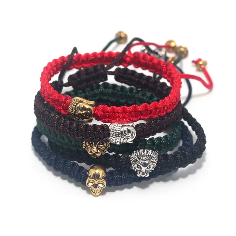 Мужской браслет макраме из черного веречка с серебряным и золотым черепом львом