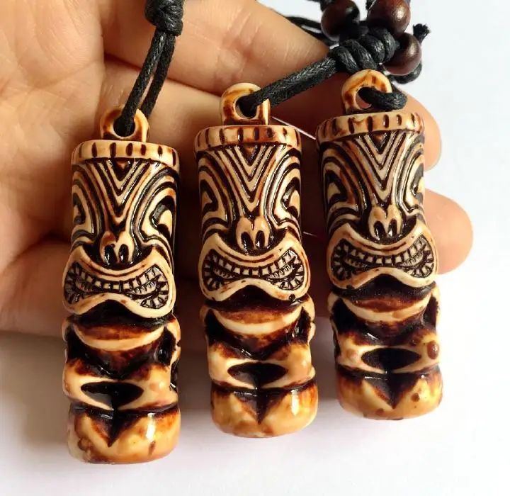 

12 NECKLACE TRIBAL CARVED TIKI MAN TOTEM LUAU HULA SURF GIRL