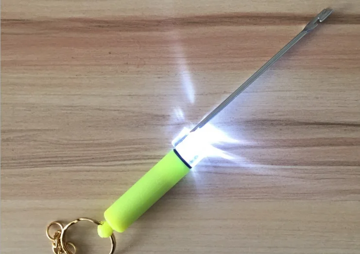

Hook separator with lamp for night fishing to take the hook out from fish's mouth
