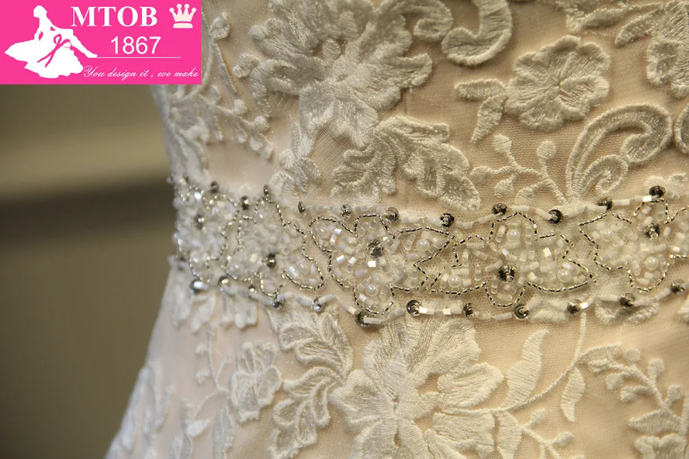 Дизайнерское привлекательное кружевное свадебное платье с юбкой-годе блестящее