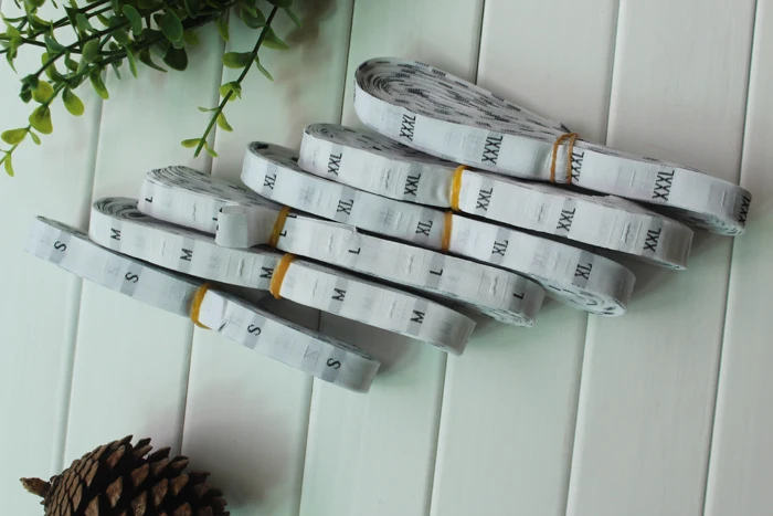 

1,2*3 см, тканые этикетки, белая ткань, черные буквы XS S M L XL XXL 3XL, 500 шт./партия