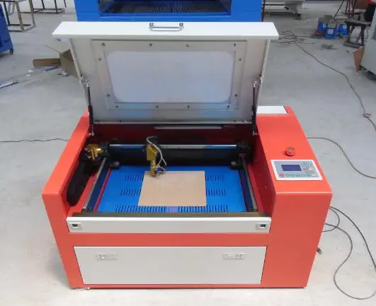 60 Вт МДФ Лазерная резка машина с Авто вверх и вниз сотовой рабочий стол |