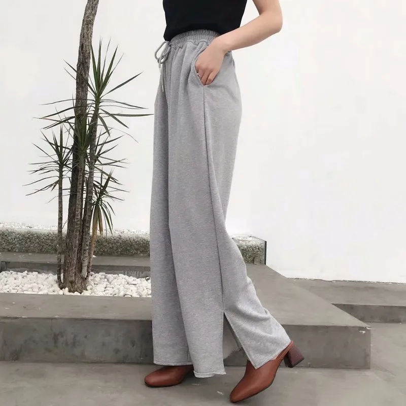 Женские брюки с разрезом TWOTWINSTYLE эластичные высокой талией и карманами на